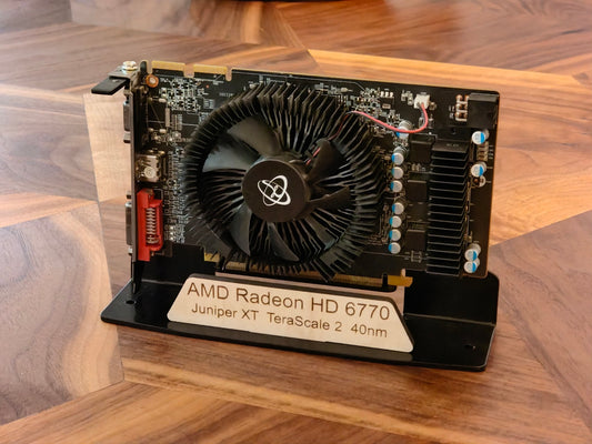 Retired AMD HD 6770 graphics card displayed on aluminum stand