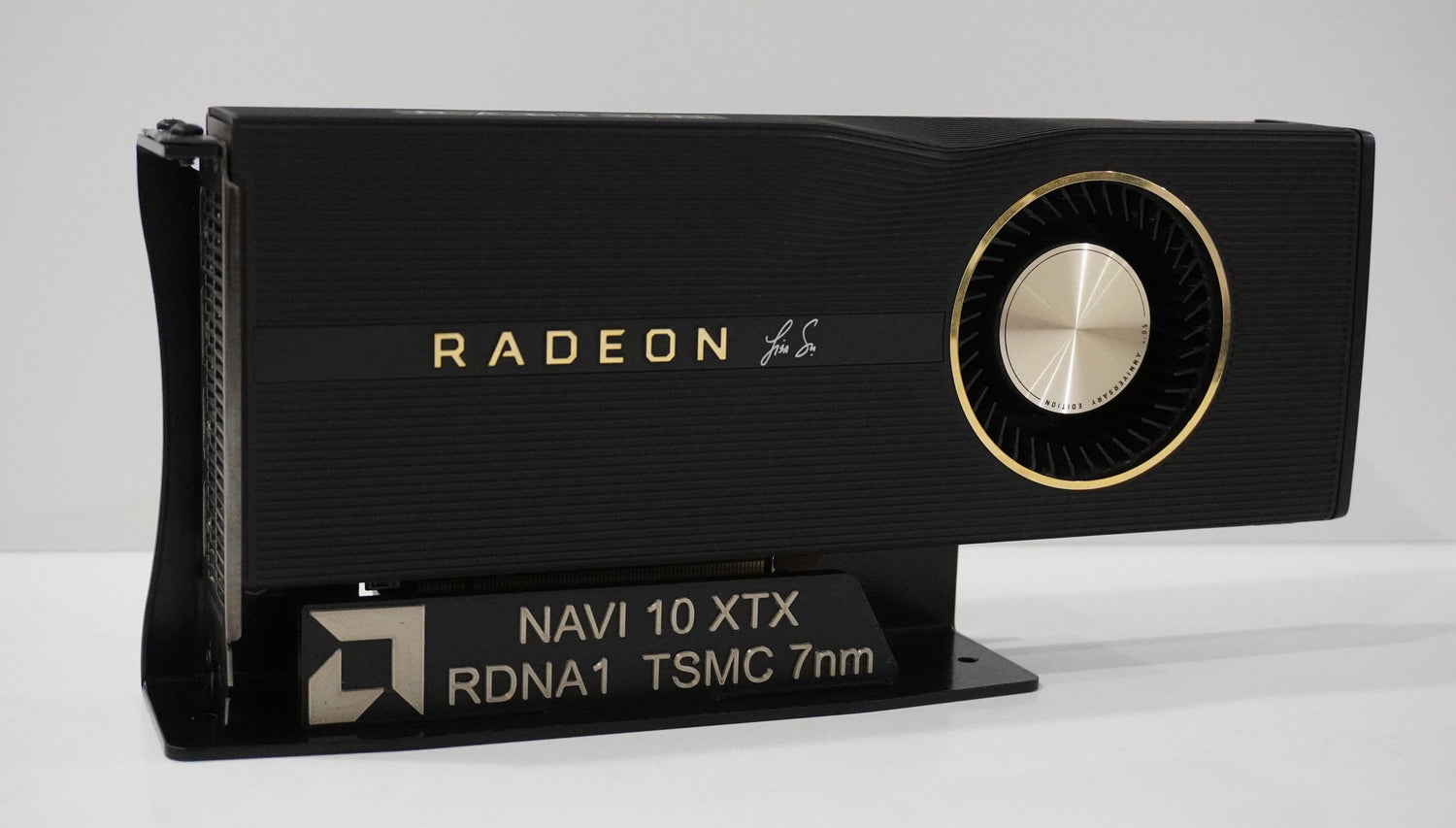 Radeon 5700XT anniversary edition on a GPU display stand with a 3d printed placard. 